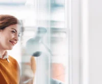 Business meeting at work at trendy startup company discussing planning strategy for growth and development using smart technology