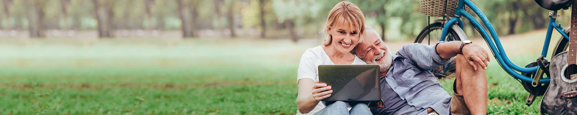 An elderly couple relaxing in a park