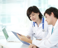 Healthcare practitioners absorbed in a discussion