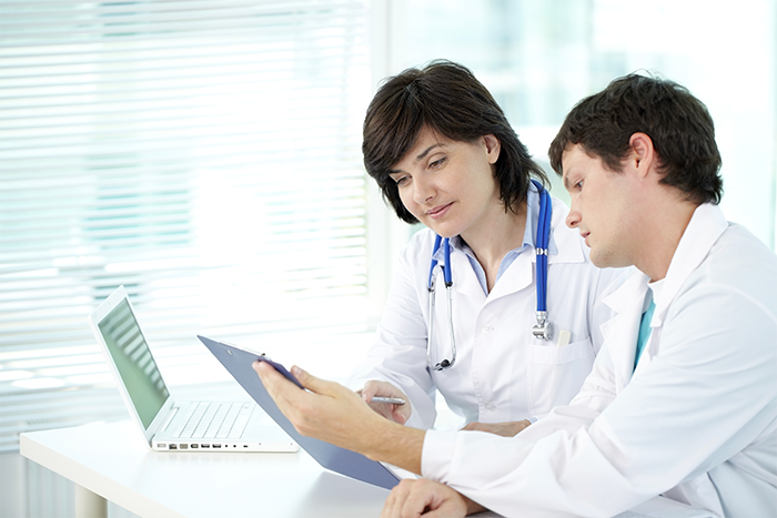 Healthcare practitioners absorbed in a discussion