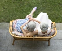 Two senior ladies with white hair captured from above