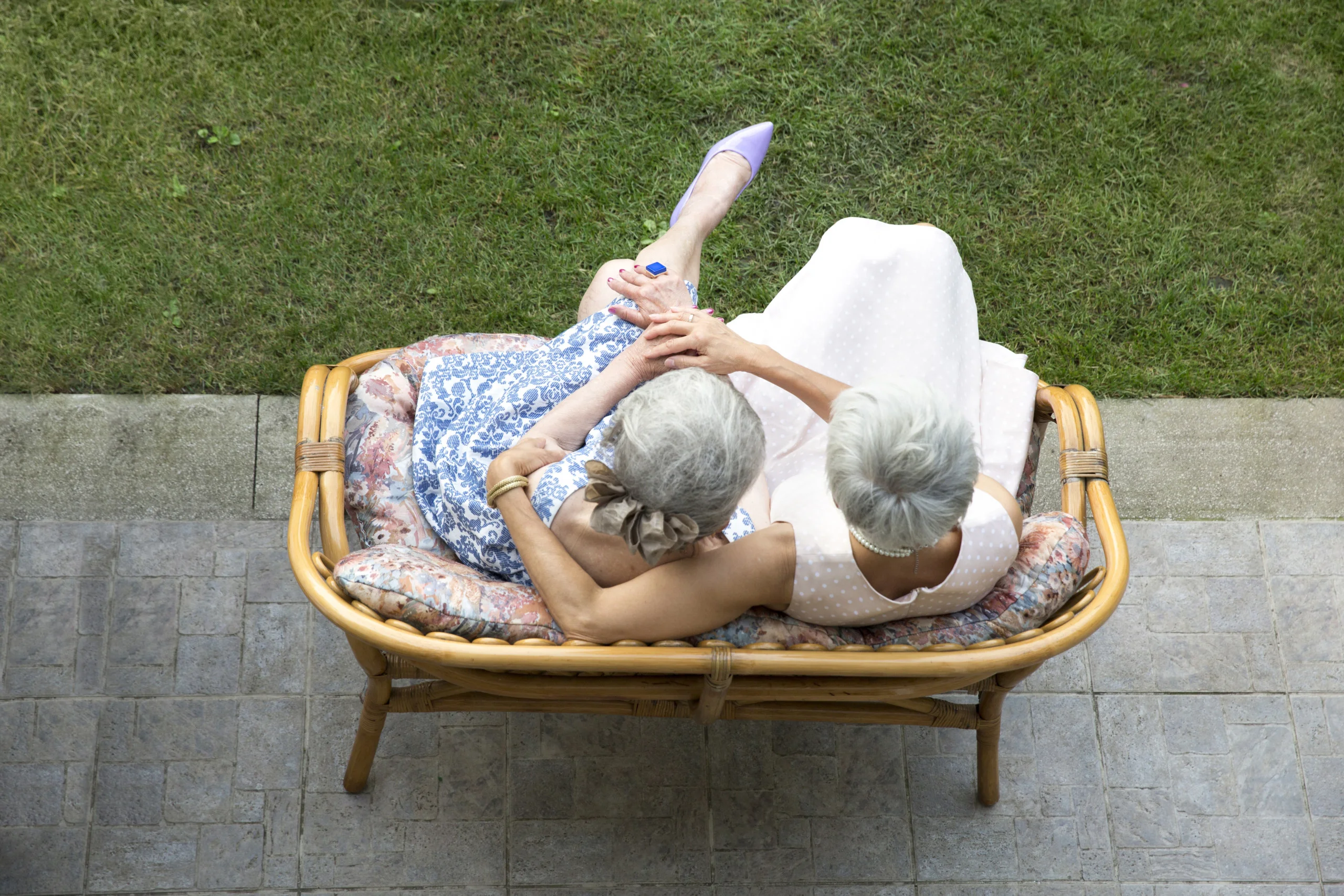 Two senior ladies with white hair captured from above