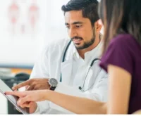 HCPs in deep discussion while pointing to an iPad