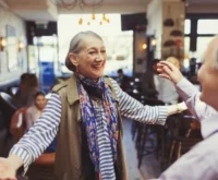 An old lady with happy mood with open arms