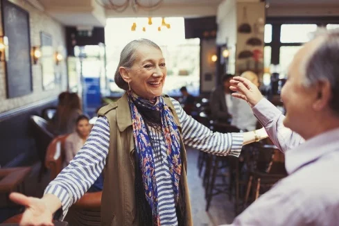 An old lady with happy mood with open arms