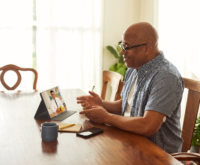 A patient attending telemedicine consultation from his home.