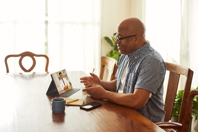 A patient attending telemedicine consultation from his home.
