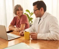 A healthcare provider discusses health statistics with the patient.