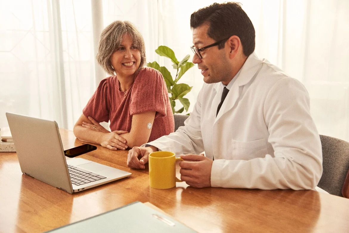 A healthcare provider discusses health statistics with the patient.