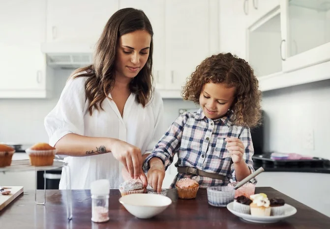 A young lady with a child baking gourmet treats