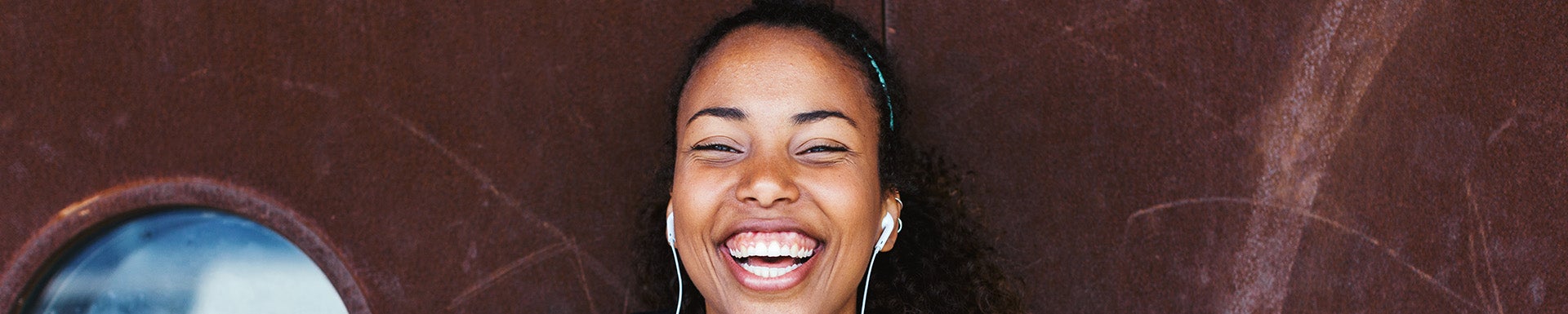 A young female smiling broadly.